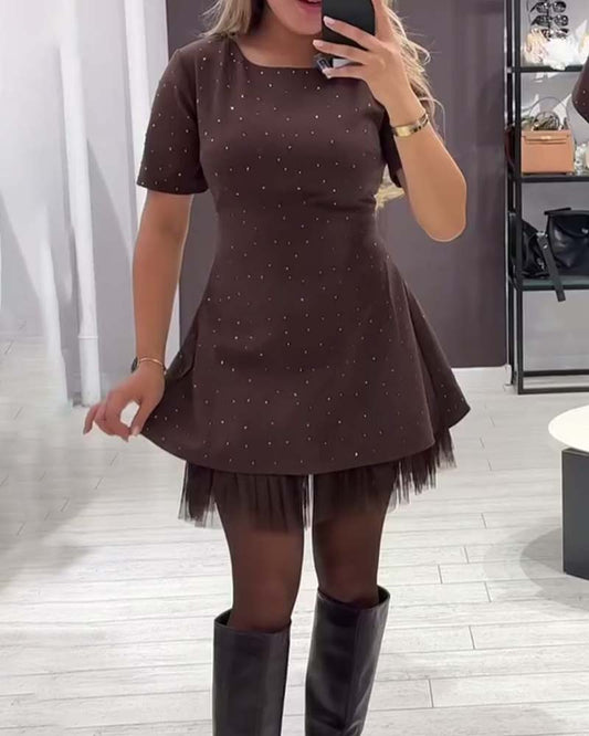 Elegante jurk met glinsterende mesh-patchwork